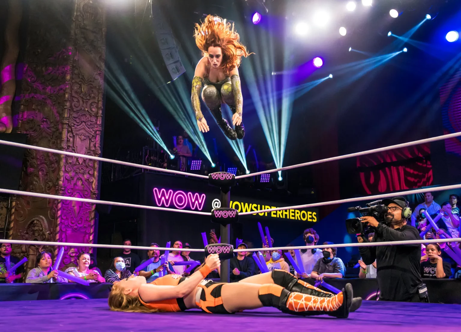 Ms. Buss saw female empowerment when she first went to a WOW show. Here, Princess Aussie jumps from the top rope onto BK Rhythm at a recent taping of WOW in Los Angeles.Credit…WOW Television Enterprises, LLC