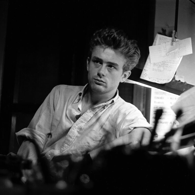 James Dean sitting at a desk