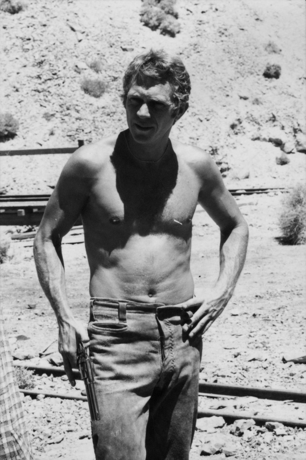 Steve McQueen holding a gun